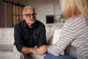 distinguished-looking older man asks therapist what is interpersonal therapy?