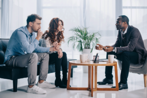 young couple talking to mental health professional while attending couples counseling in Columbia, MD.