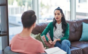 A woman learns about TMS therapy for depression.