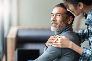 middle-aged man being consoled by family member and understanding the role of family in mental health