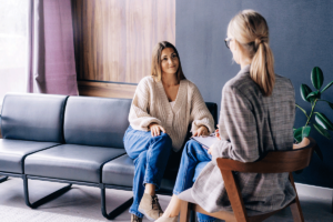 A woman participates in cognitive-behavioral therapy for her mental health.