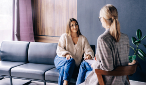 A woman participates in cognitive-behavioral therapy for her mental health.